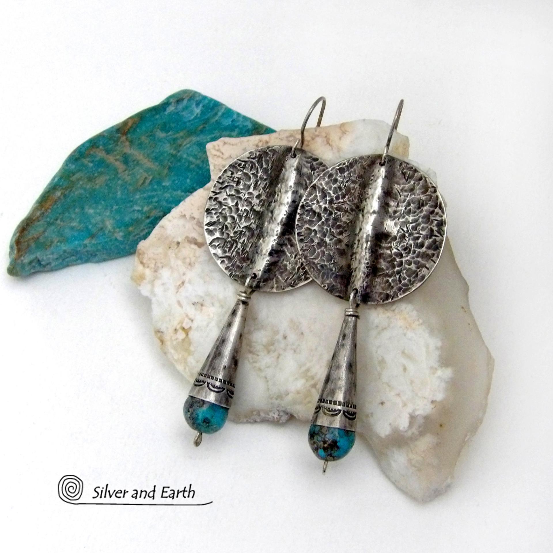 Big and bold - these handcrafted sterling silver earrings have an earthy, organic design with an edgy, modern southwest style. They feature solid sterling silver with a rustic, hammered texture and a dark oxidized finish. They are accented with hammered and hand stamped sterling silver cones and natural turquoise stone beads. Perfect for women that love to wear bold organic looking jewelry with a subtle southwest style and flair. Handmade in USA by Silver and Earth, a New Mexico True Certified Business.