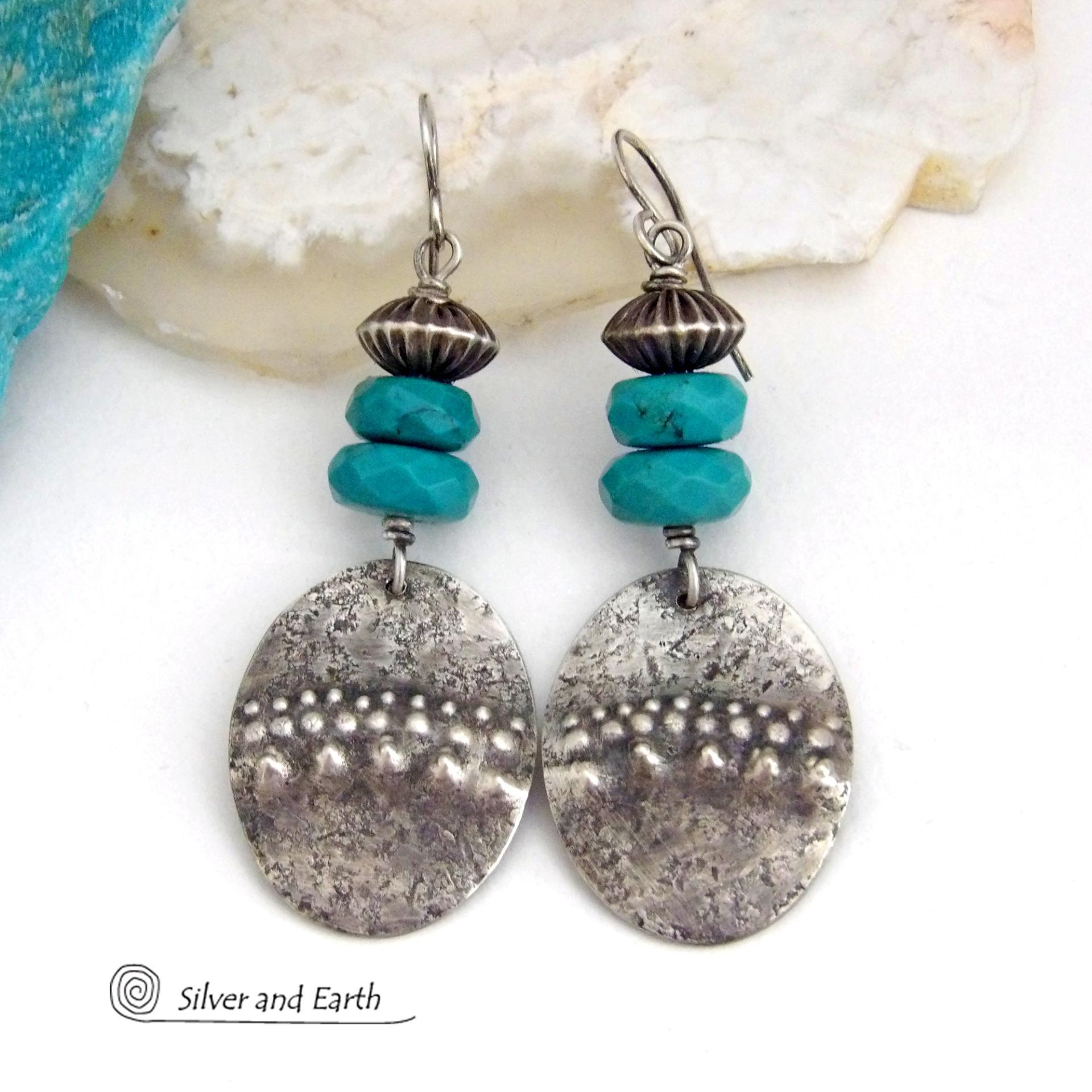 These handcrafted earrings feature sterling silver oval dangles with a hammered and hand stamped texture accented with faceted natural turquoise gemstones and oxidized sterling silver beads with a rich, corrugated texture and oxidized finish. They have a modern, southwestern style and are perfect for women that love to wear artisan handcrafted southwestern jewelry. Handmade in the USA by Silver and Earth jewelry, a New Mexico True Certified business. 