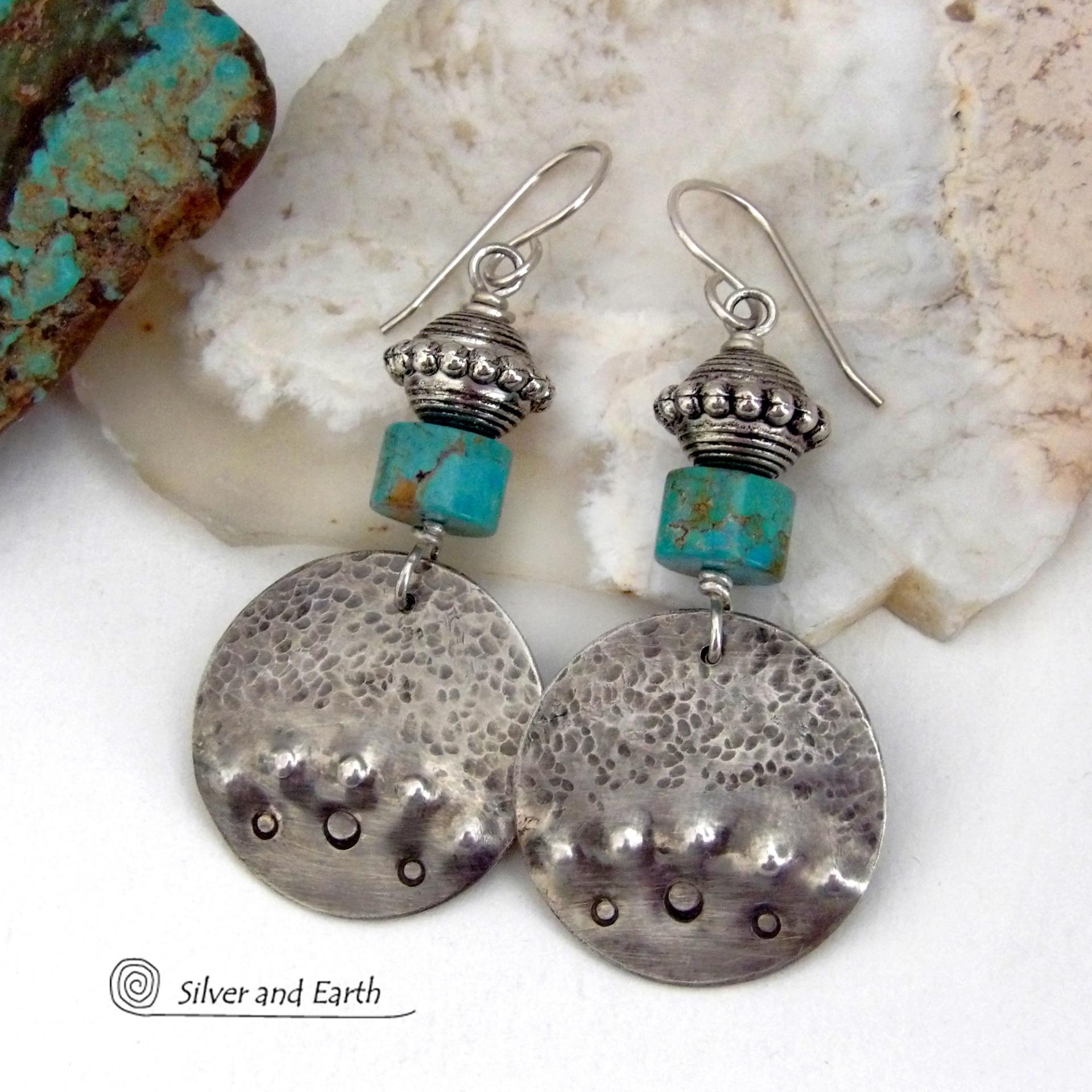 These handcrafted earrings feature uniquely textured hammered and hand stamped sterling silver accented with natural turquoise stones and silver plated beads. Bold and striking, they have a modern, southwest style with a touch of tribal flair. Handmade in the USA by Silver and Earth Jewelry. 