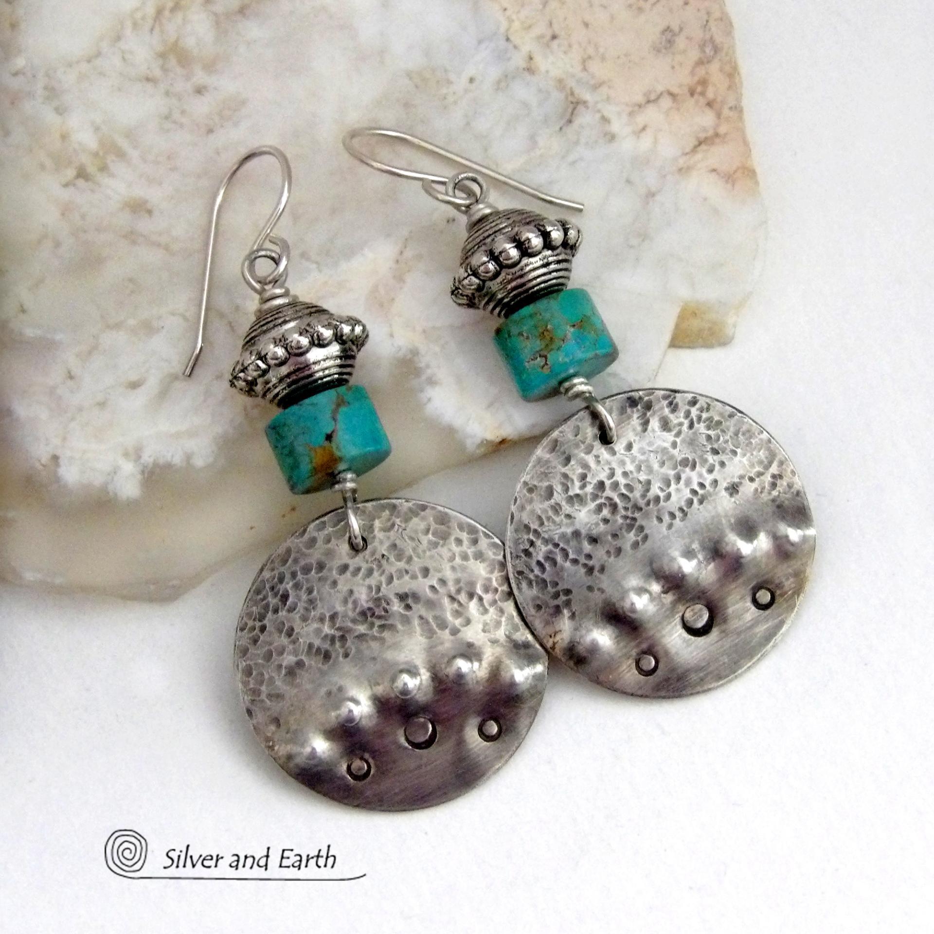These handcrafted earrings feature uniquely textured hammered and hand stamped sterling silver accented with natural turquoise stones and silver plated beads. Bold and striking, they have a modern, southwest style with a touch of tribal flair. Handmade in the USA by Silver and Earth Jewelry. 