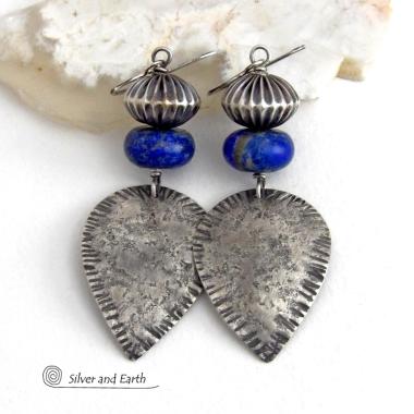 Big and bold - these earrings feature handcrafted sterling silver dangles with a rustic, organic texture accented with chunky natural blue lapis lazuli gemstones and Native style oxidized sterling silver beads with a rich, corrugated texture. They have a modern southwestern and tribal flair that makes a bold statement. Perfect for women that love artisan handcrafted southwest Santa Fe style jewelry. Handmade in the USA by Silver and Earth Jewelry - a New Mexico True Certified Business. 