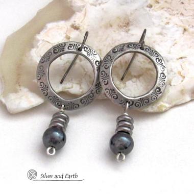 These silver pewter hoop earrings have a hand stamped texture and are accented with hematite gemstones and stainless steel beads. The stones have a metallic gray hue which cast offs a bit of natural shimmer & shine. They have a modern chic style that coordinates beautifully with all wardrobe styles. Earrings are lightweight and comfortable to wear. Handmade in the USA by Silver and Earth Jewelry. 