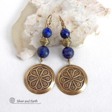 These handcrafted gold brass earrings have an exotic, Egyptian inspired vibe. They feature brass circle dangles with a beautiful embossed texture accented with faceted genuine lapis lazuli gemstones and textured brass beads. Bold and unique, they'll add a touch of cultural exotic charm to any type of wardrobe - dressed up or down. Perfect for women that love unique artisan handcrafted jewelry. 