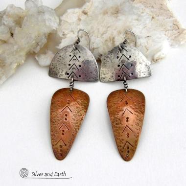Unique and striking, these handcrafted mixed metal sterling silver and copper earrings will make a bold statement. They have a modern contemporary style with a tribal vibe. The combination of metals will mix and match beautifully with other copper and silver accessories in your wardrobe. Handmade in the USA by Silver and Earth Jewelry.